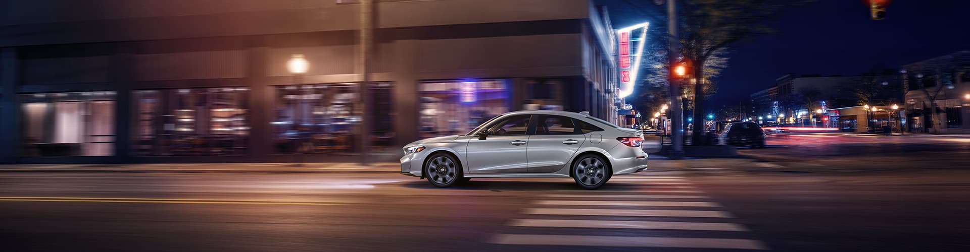 2026 Civic Sedan Sport Touring Hybrid pictured. Find Honda's latest lineup of hybrid and electric vehicles for sale in Roanoke, VA, serving surrounding communities from Blacksburg to Lynchburg